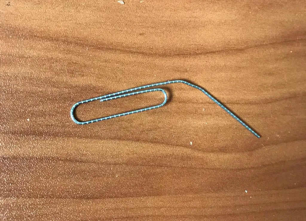 Unfolded paperclip to reset modem