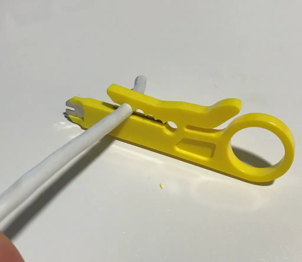 Ethernet cable stripping tool with ethernet cable
